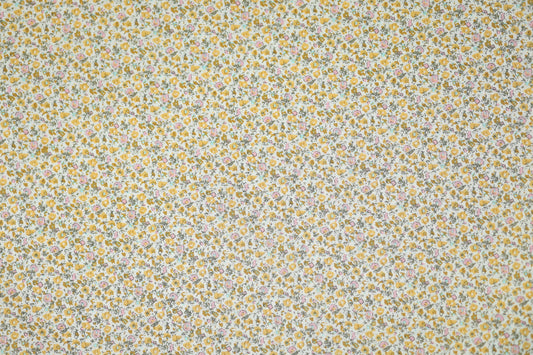 Floraler Baumwoll-Stretchstoff in Goldene Wiesenblumen – ideal für Bekleidung und kreative Projekte