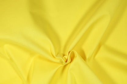 Baumwoll Stretch Stoff in Sonnengelb – elastisch und hautfreundlich